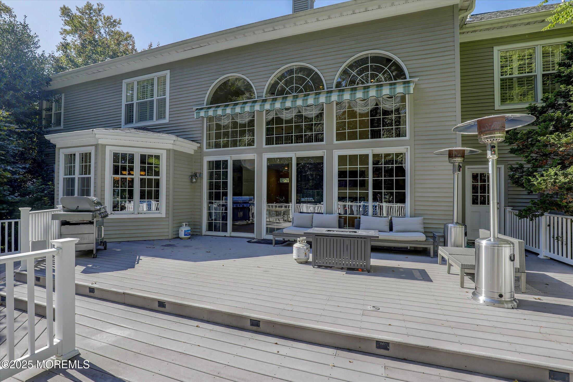 26 Bruns Road West Allenhurst, NJ 07711 - Photo 52 of 66 a front view of a house with many windows and plants