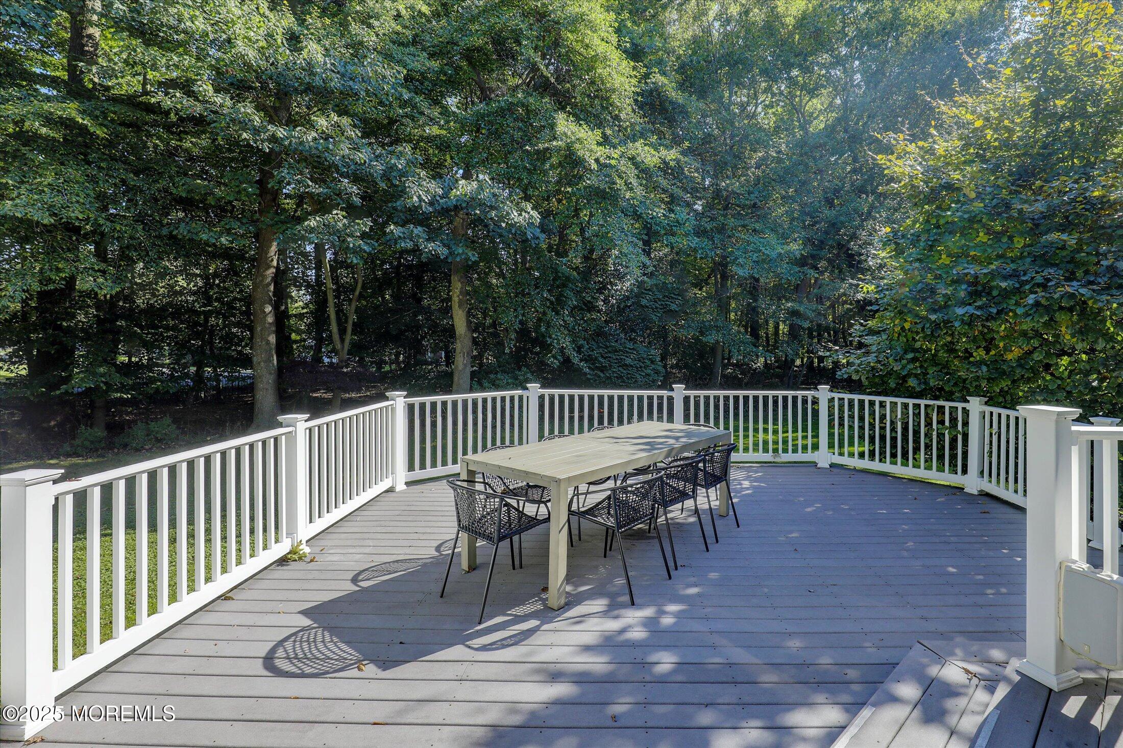 26 Bruns Road West Allenhurst, NJ 07711 - Photo 55 of 66 a view of a chairs and table on the deck