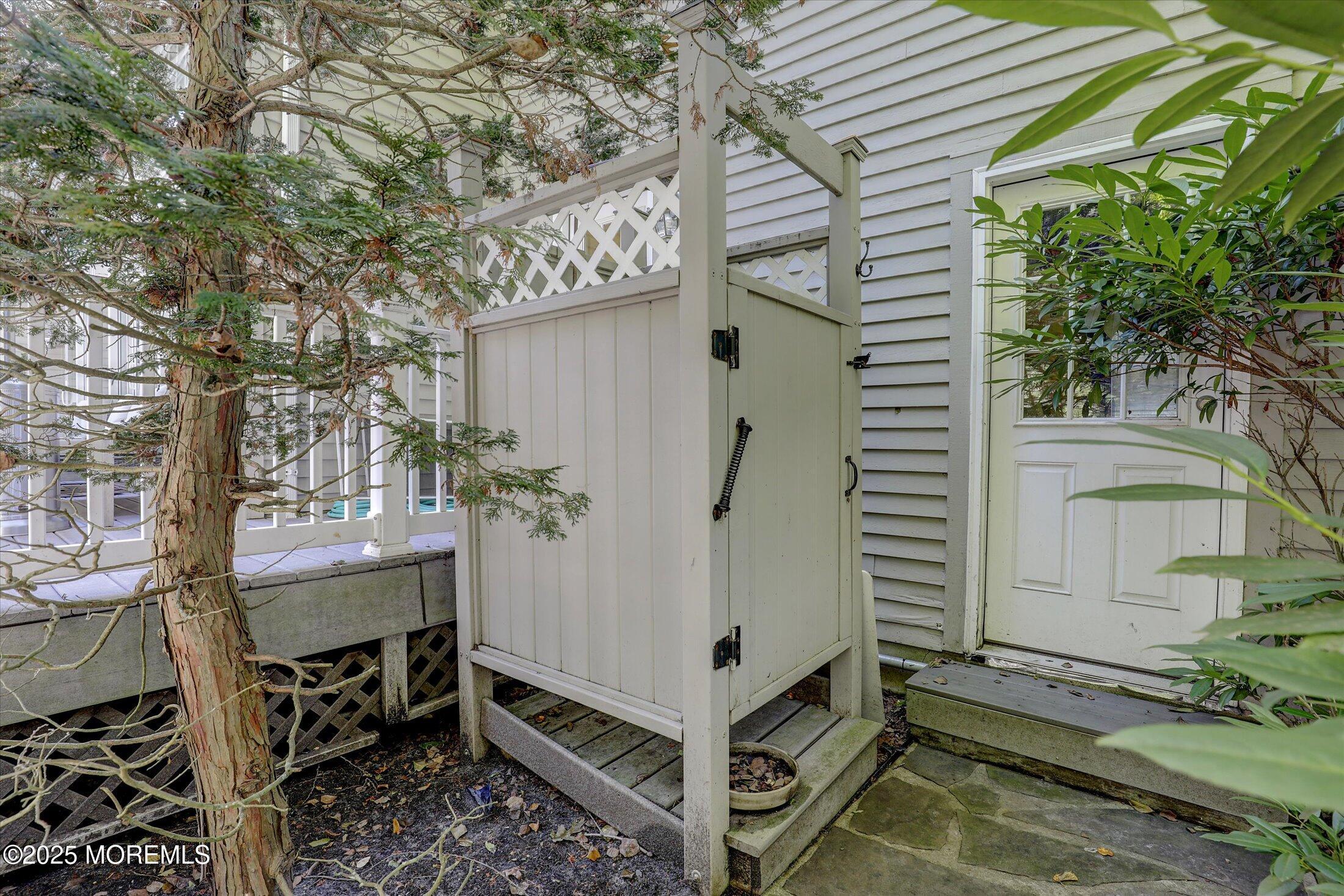 26 Bruns Road West Allenhurst, NJ 07711 - Photo 56 of 66 a view of a balcony with furniture and a potted plant