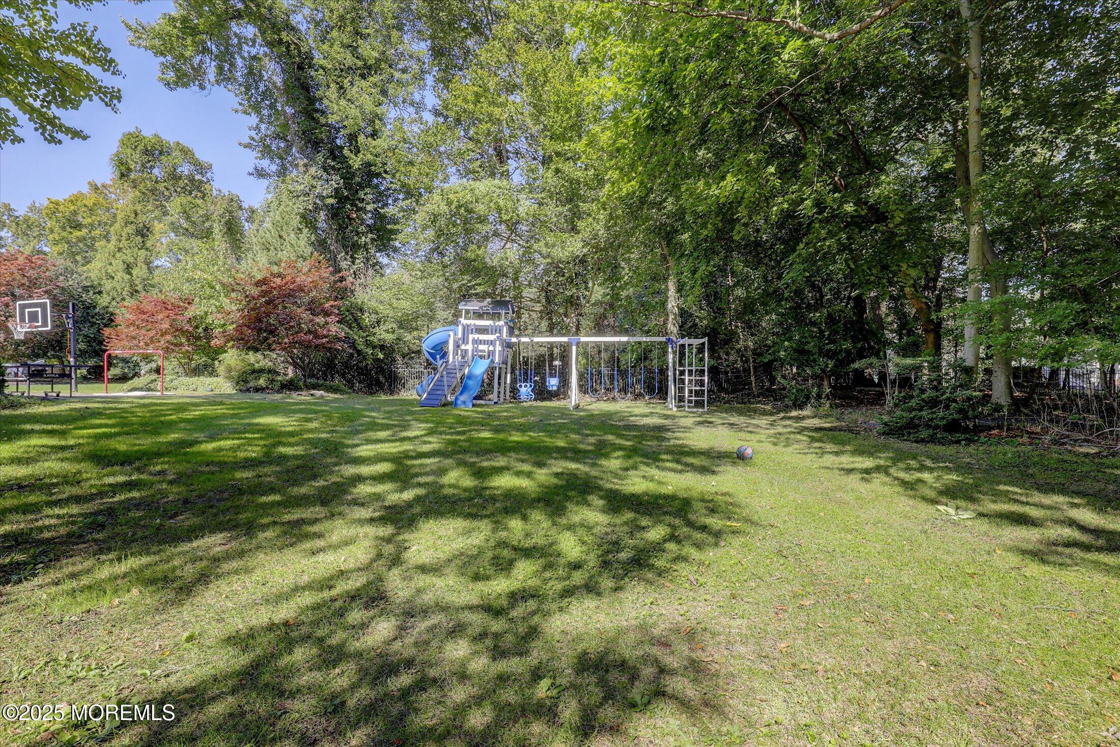 26 Bruns Road West Allenhurst, NJ 07711 - Photo 58 of 66 a house view with swimming pool in front of it