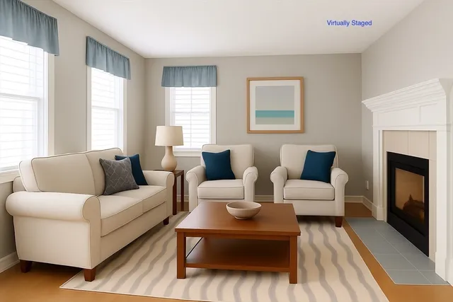 a view of a bedroom with wooden floor and windows