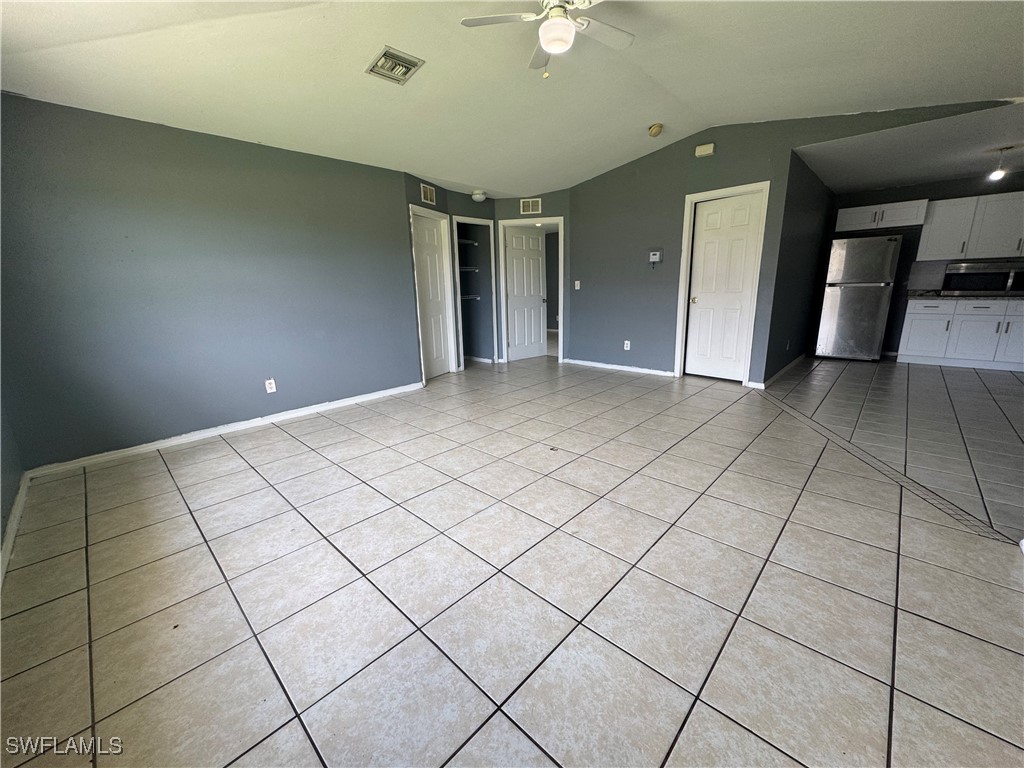 4541 21st Street Southwest Lehigh Acres, FL 33973 - Photo 5 of 15 a view of an empty room and window
