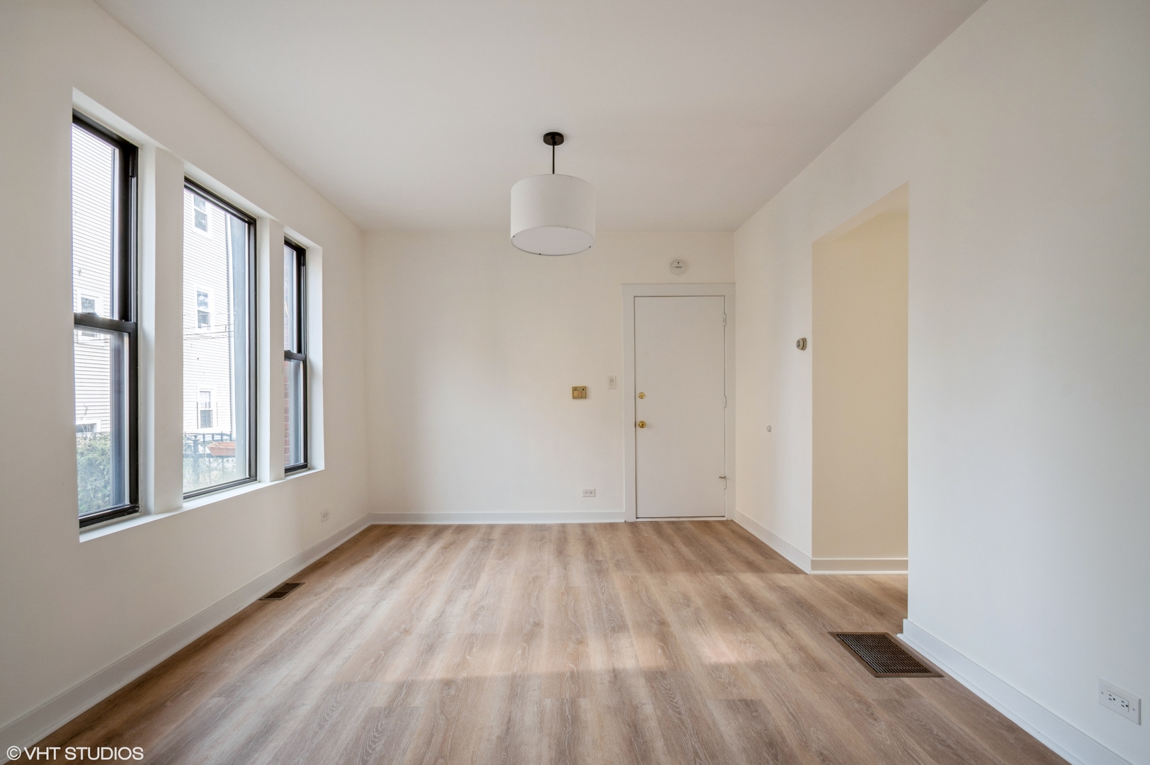 2845 West Division Street Chicago, IL 60622 - Photo 46 of 49 a view of empty room with wooden floor and windows