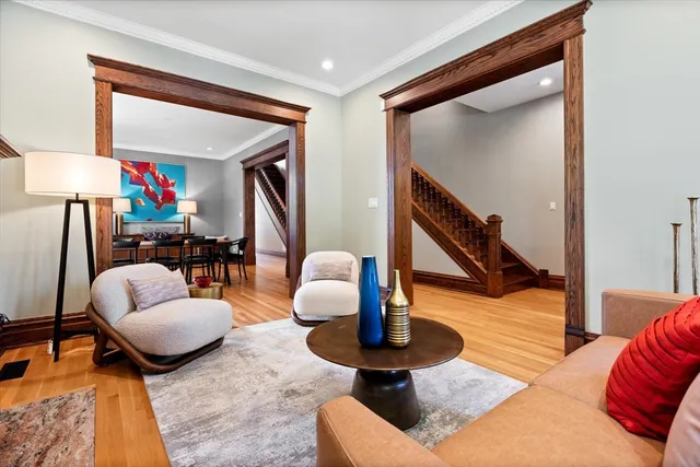 a living room with furniture and a lamp