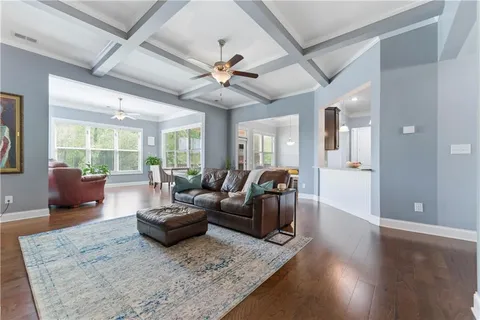 a living room with furniture and windows