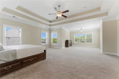 a spacious bathroom with a tub sink shower and mirror