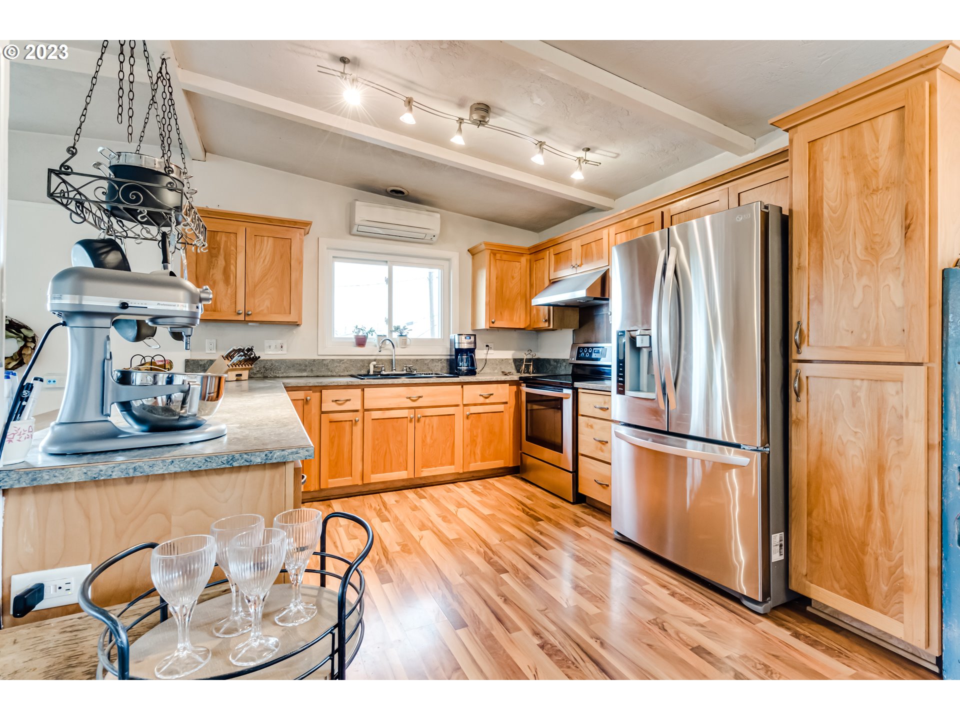 460 South 4th Street Springfield, OR 97477 - Photo 5 of 32 a kitchen with stainless steel appliances granite countertop a refrigerator and a sink