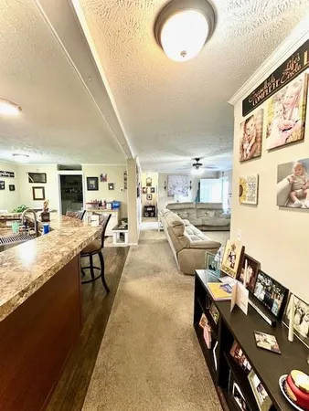a living room with lots of furniture and a wooden floor