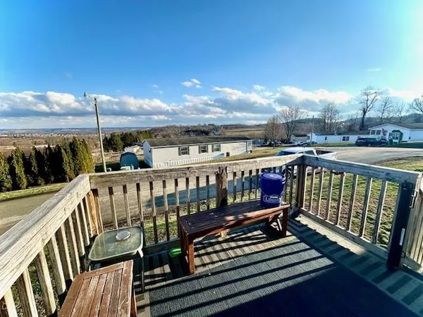 a view of a balcony with wooden floor