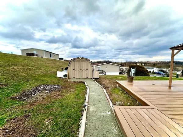 a view of a swimming pool with a yard