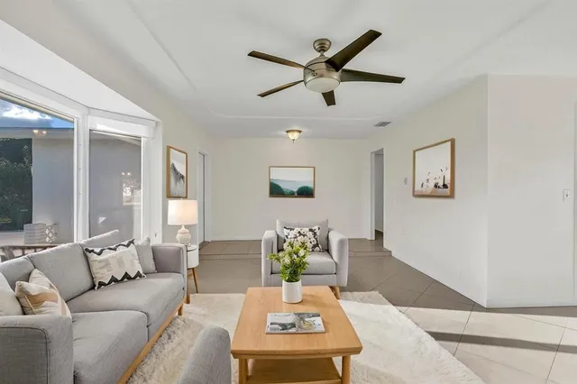a living room with furniture and a large window