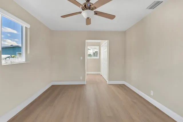a kitchen with stainless steel appliances granite countertop a stove microwave and refrigerator