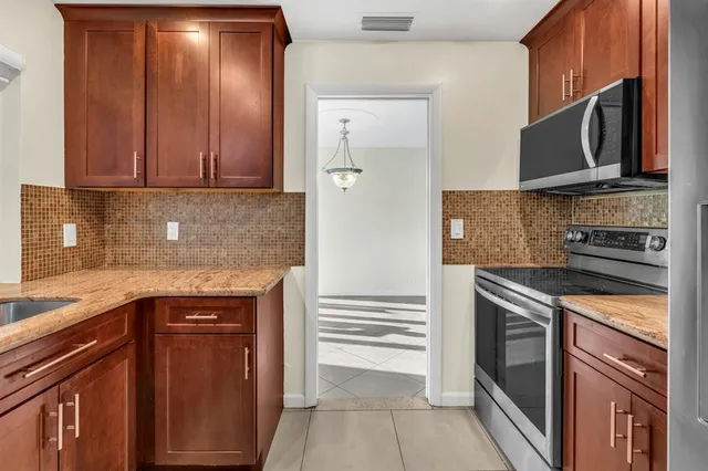 a bathroom with a sink vanity and a toilet