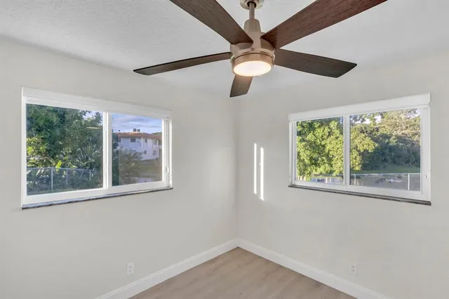 a view of a living room and floor to ceiling window