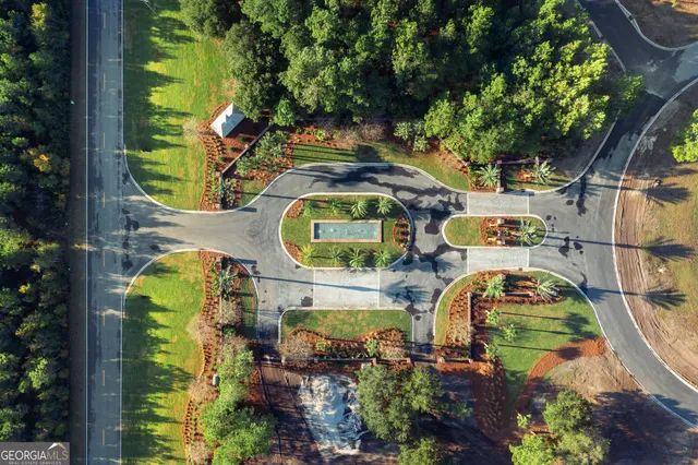 an aerial view of residential house with outdoor space and swimming pool