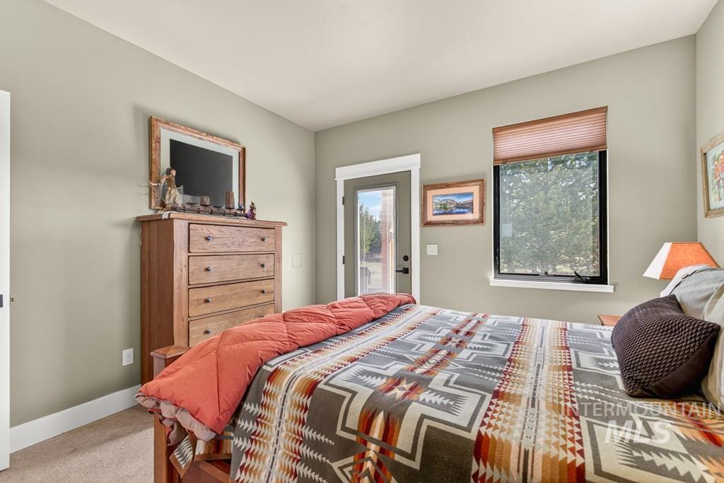 13800 Raptor Loop McCall, ID 83638 - Photo 16 of 34 Neutral-toned bedroom featuring carpet flooring and light-colored walls