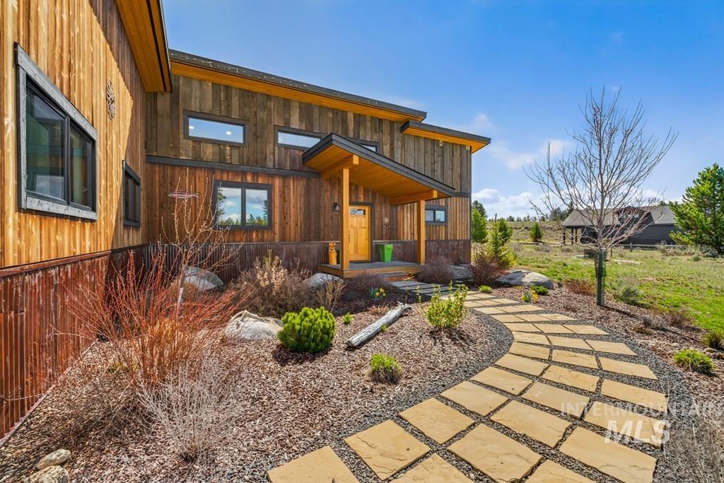 13800 Raptor Loop McCall, ID 83638 - Photo 24 of 34 Modern wood-sided residence featuring a natural stone paver pathway