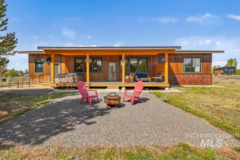 13800 Raptor Loop McCall, ID 83638 - Photo 28 of 34 Contemporary exterior featuring natural wood siding and a flat roofline