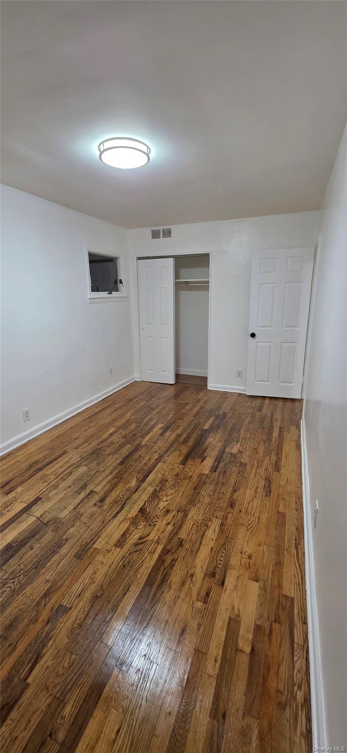 1574 Paulding Avenue, Unit 2 Bronx, NY 10462 - Photo 2 of 25 a view of empty room with wooden floor