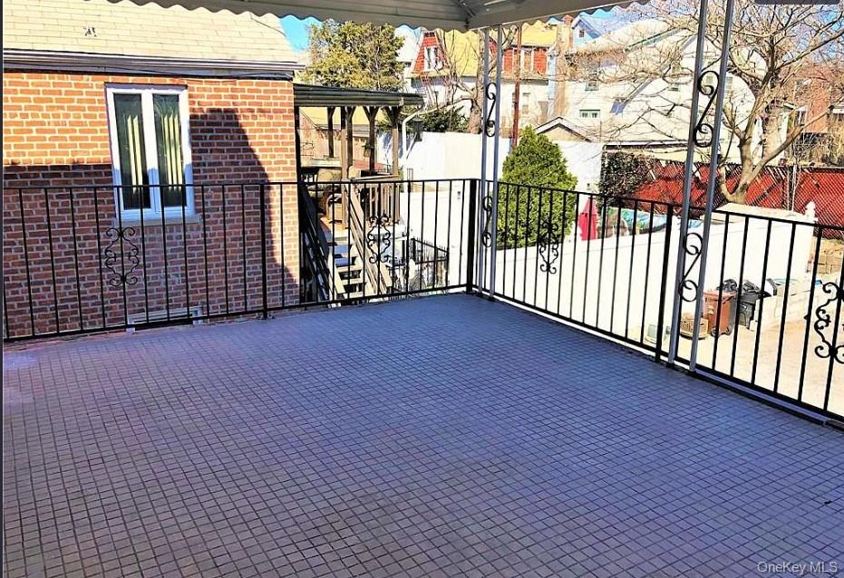 1574 Paulding Avenue, Unit 2 Bronx, NY 10462 - Photo 21 of 25 a view of a balcony with wooden floor