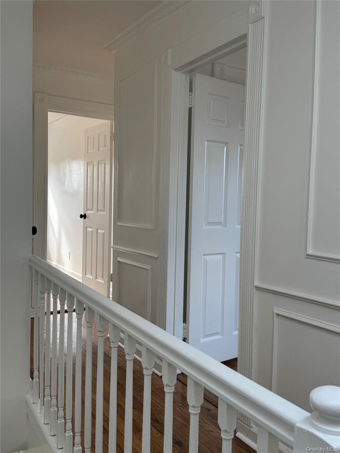 1574 Paulding Avenue, Unit 2 Bronx, NY 10462 - Photo 8 of 25 a view of a hallway with wooden floor