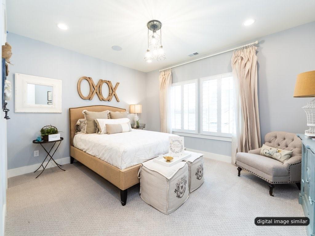 14903 Laura Michelle Road, Unit 67 Huntersville, NC 28078 - Photo 26 of 31 a bedroom with a bed and a couch