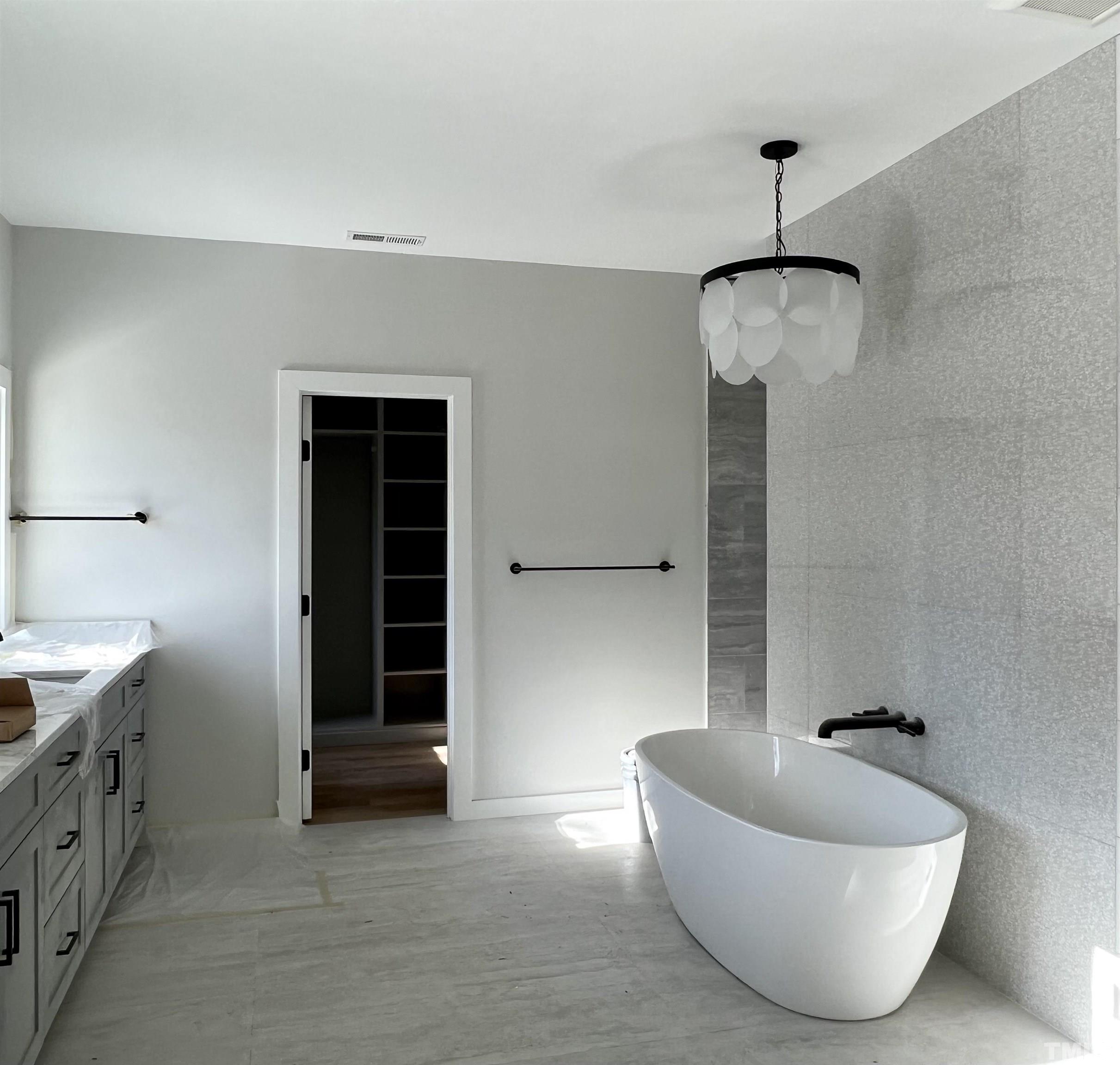 203 Woodburn Road Raleigh, NC 27605 - Photo 5 of 7 a bathroom with a bathtub and shower