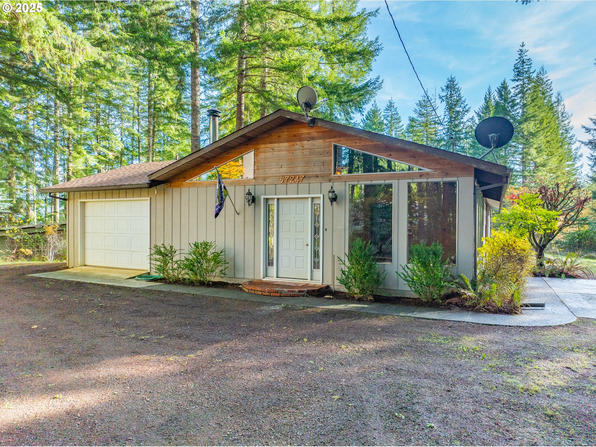 a view of a house with a yard and plants