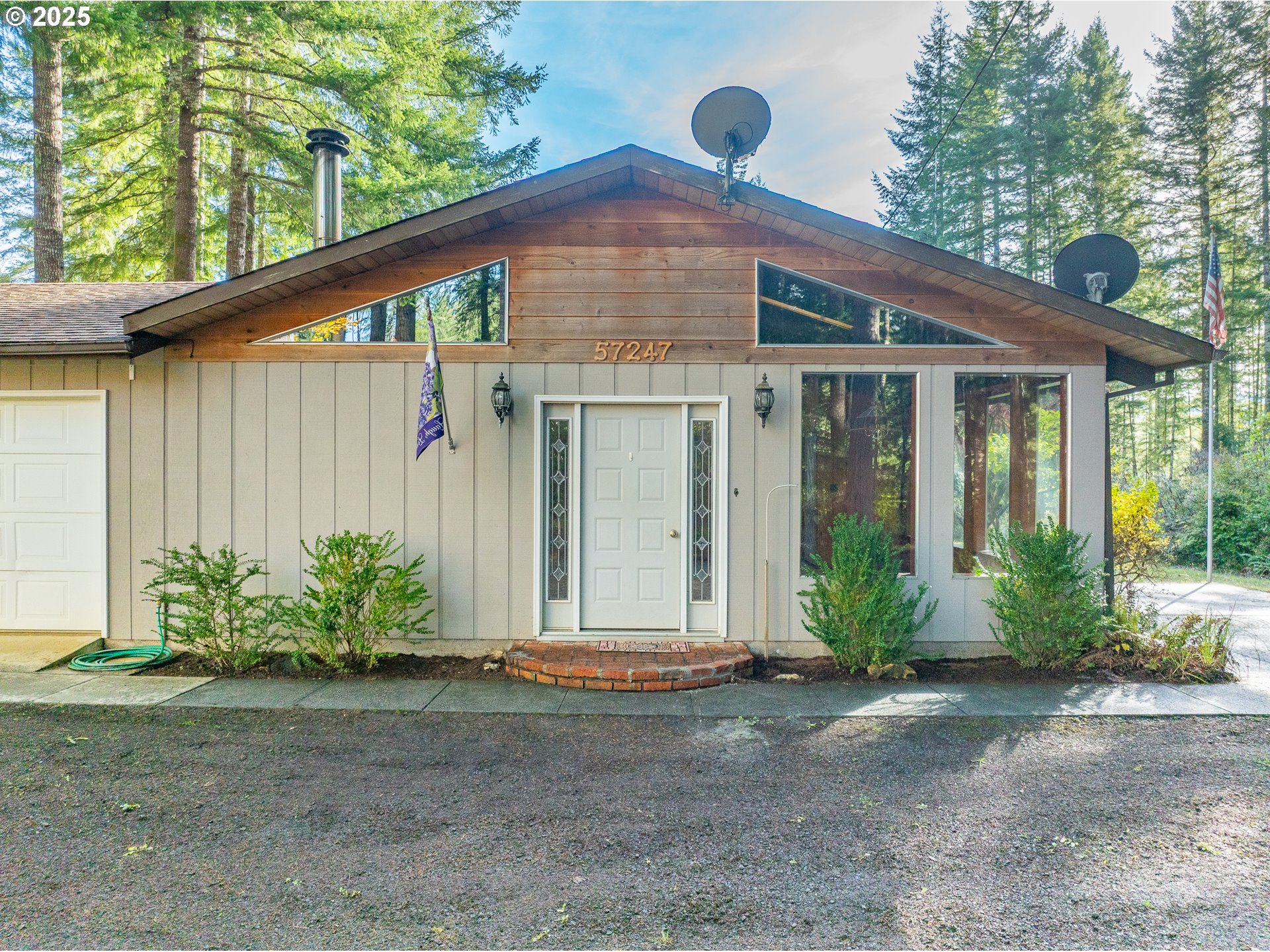 57247 Fairview Road Coquille, OR 97423 - Photo 11 of 45 a front view of a house with garden
