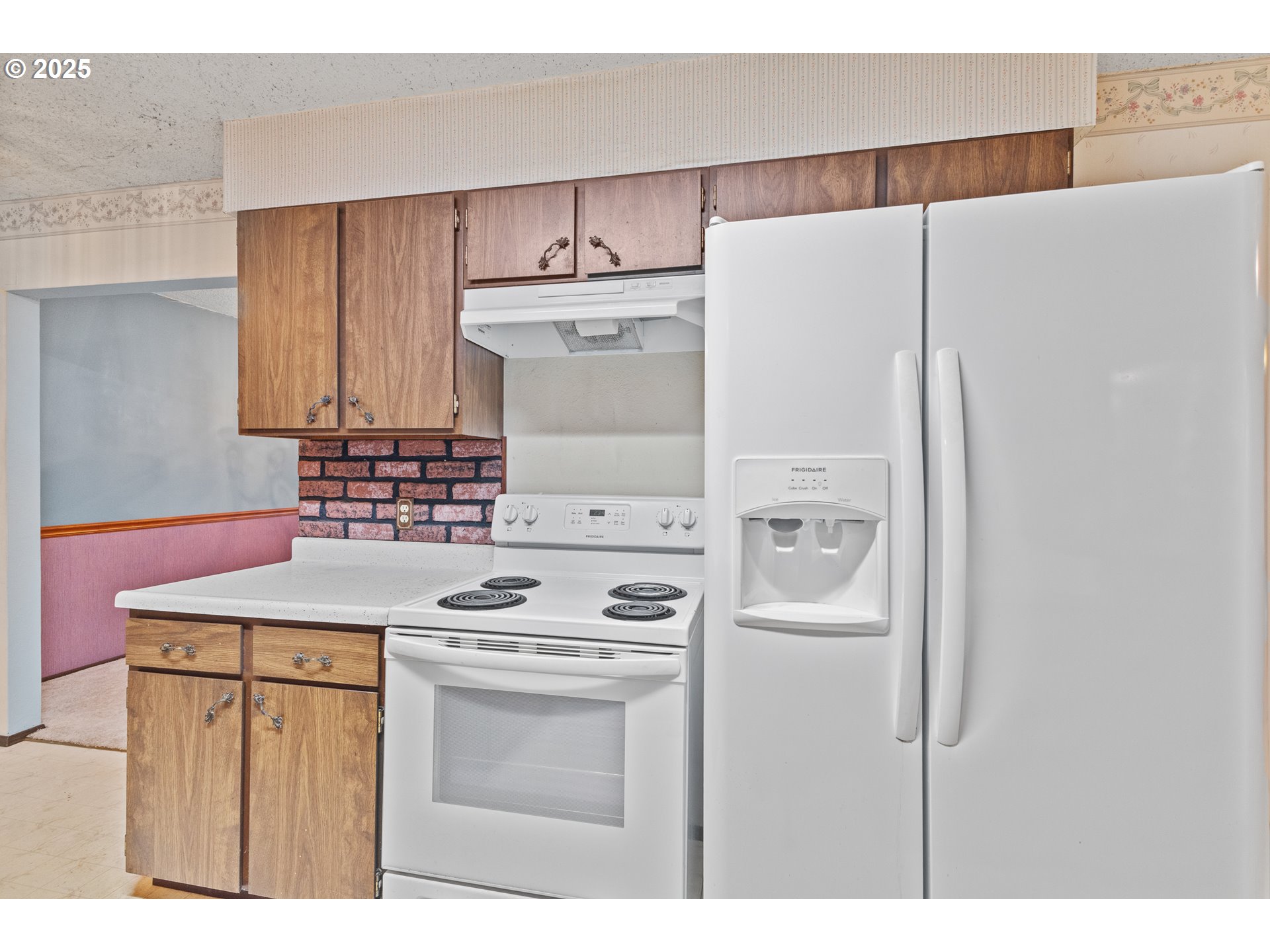 57247 Fairview Road Coquille, OR 97423 - Photo 16 of 45 a kitchen with refrigerator a stove and a cabinets