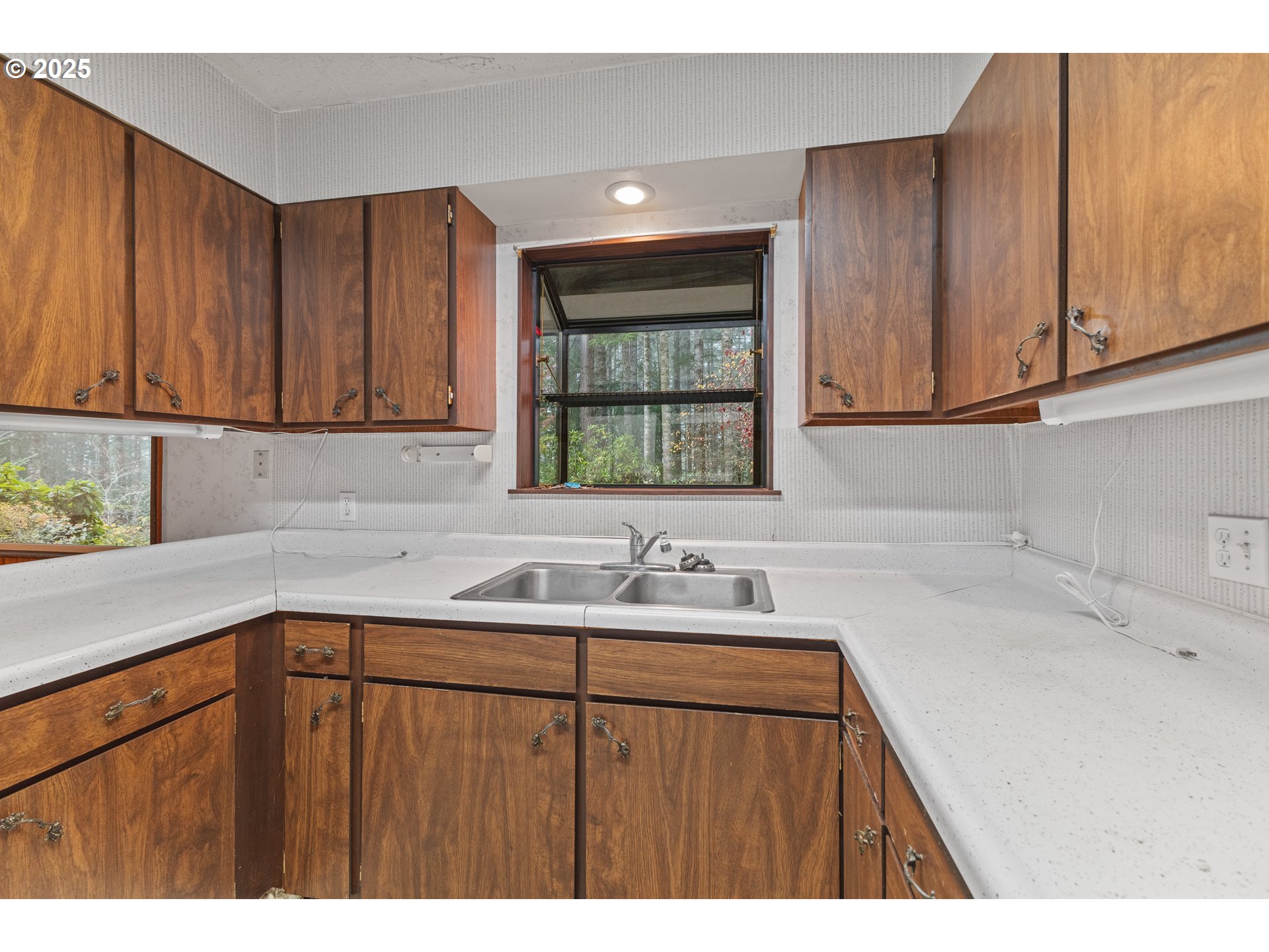 57247 Fairview Road Coquille, OR 97423 - Photo 17 of 45 a kitchen with a sink cabinets and window
