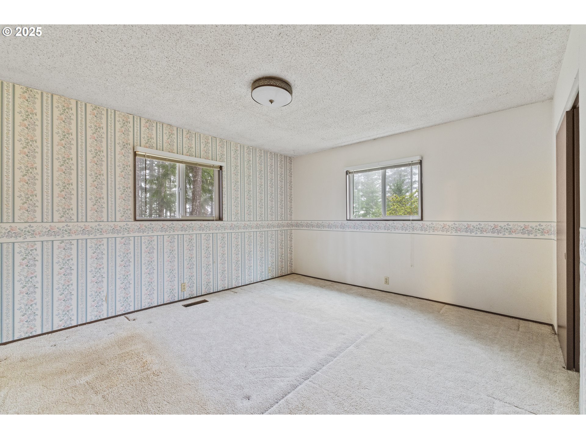 57247 Fairview Road Coquille, OR 97423 - Photo 30 of 45 an empty room with windows