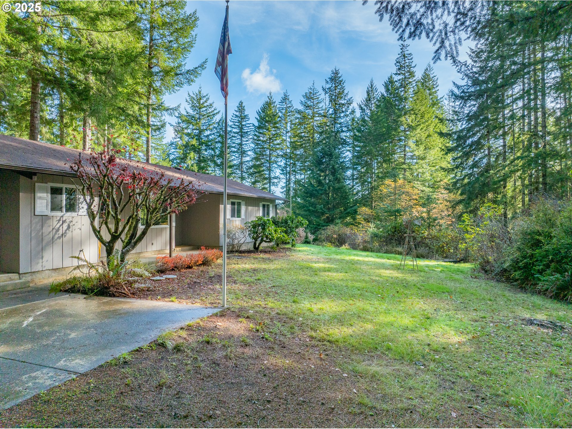 57247 Fairview Road Coquille, OR 97423 - Photo 3 of 45 a view of a house with backyard and a tree