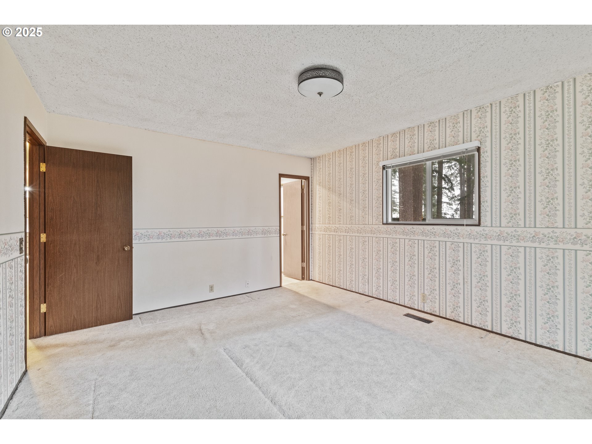 57247 Fairview Road Coquille, OR 97423 - Photo 31 of 45 a view of an empty room with a window