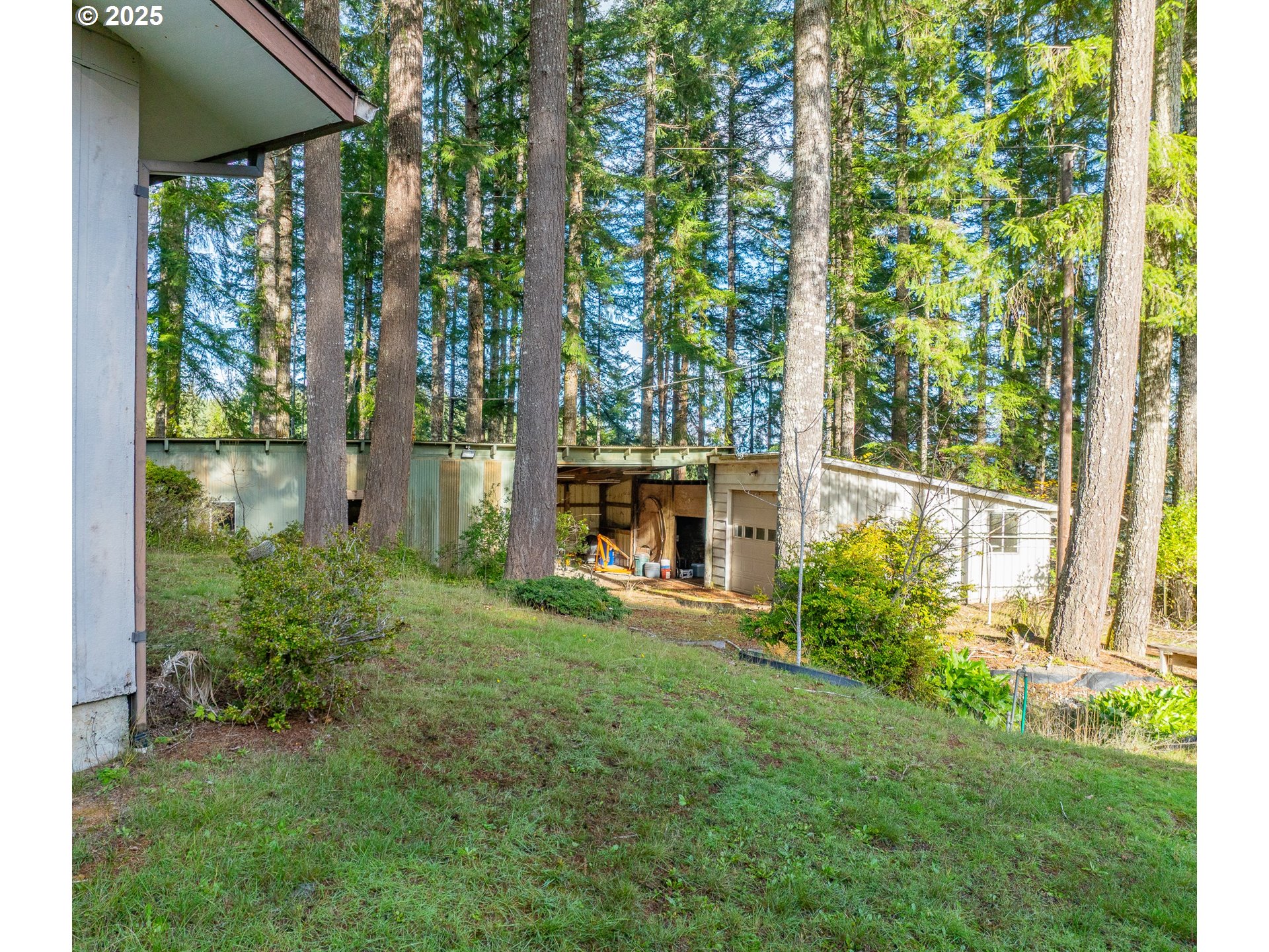 57247 Fairview Road Coquille, OR 97423 - Photo 37 of 45 a view of house with backyard and garden