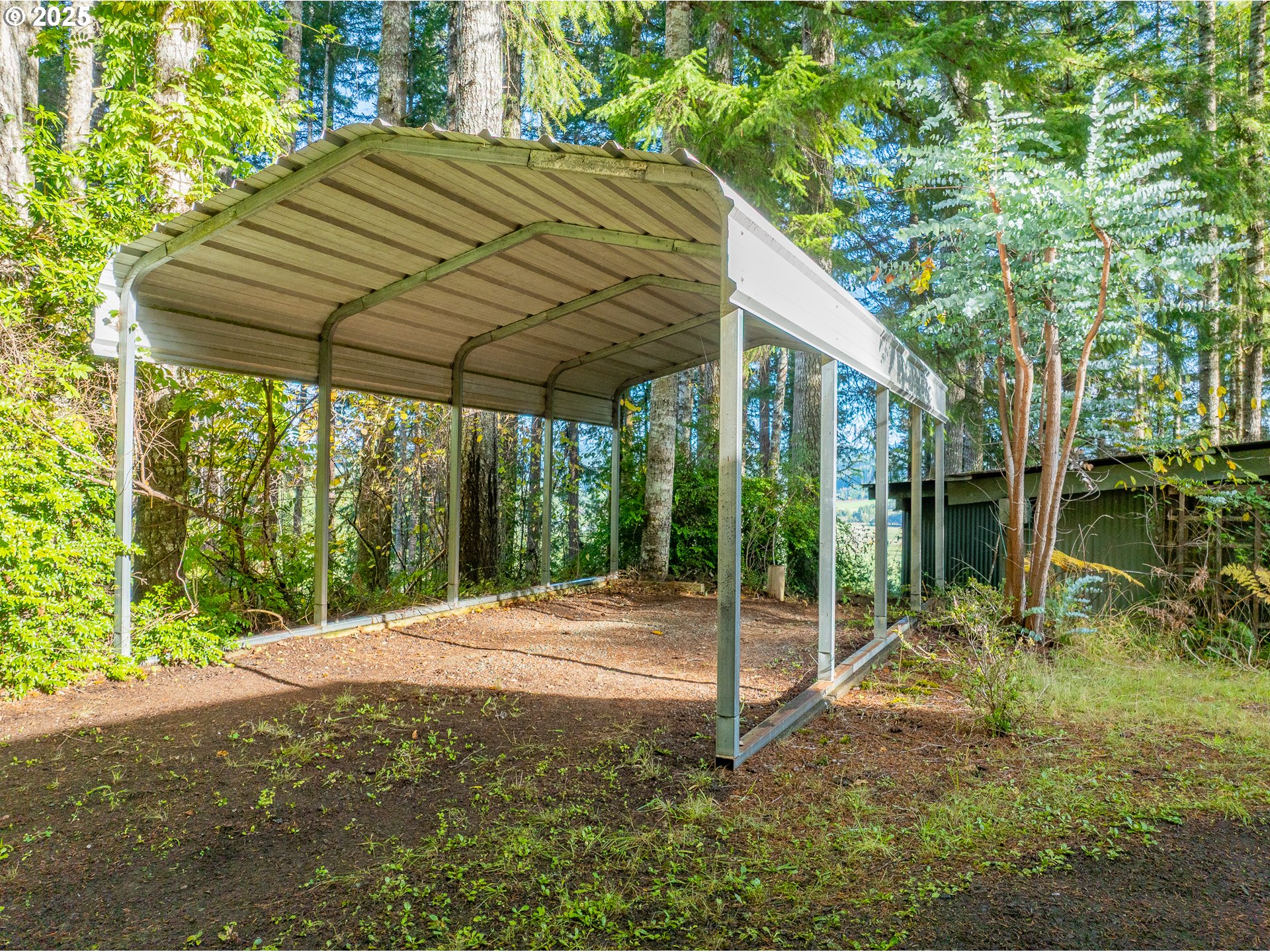 57247 Fairview Road Coquille, OR 97423 - Photo 40 of 45 a backyard of a house with table and chairs