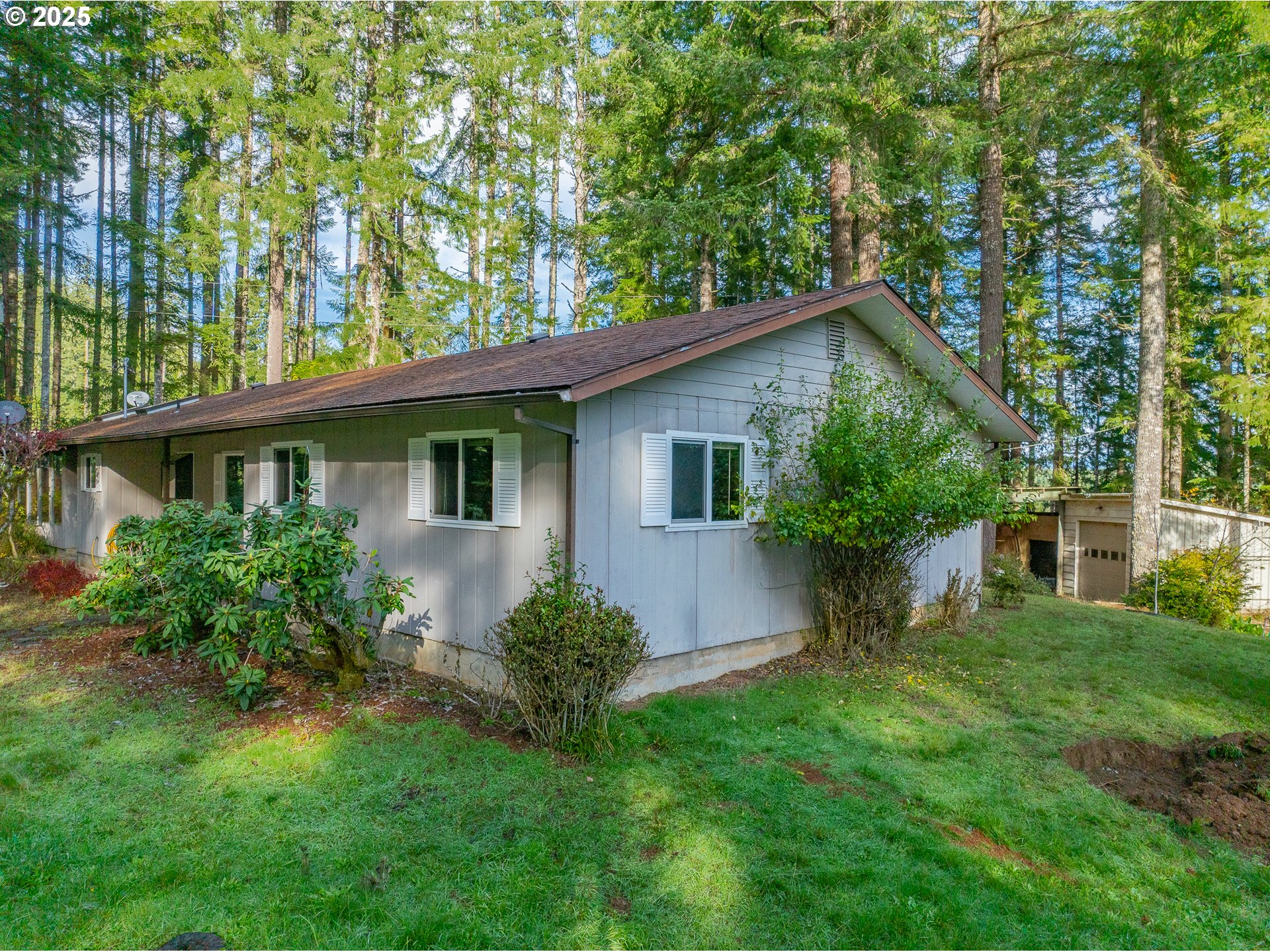 57247 Fairview Road Coquille, OR 97423 - Photo 4 of 45 a front view of a house with a yard and potted plants
