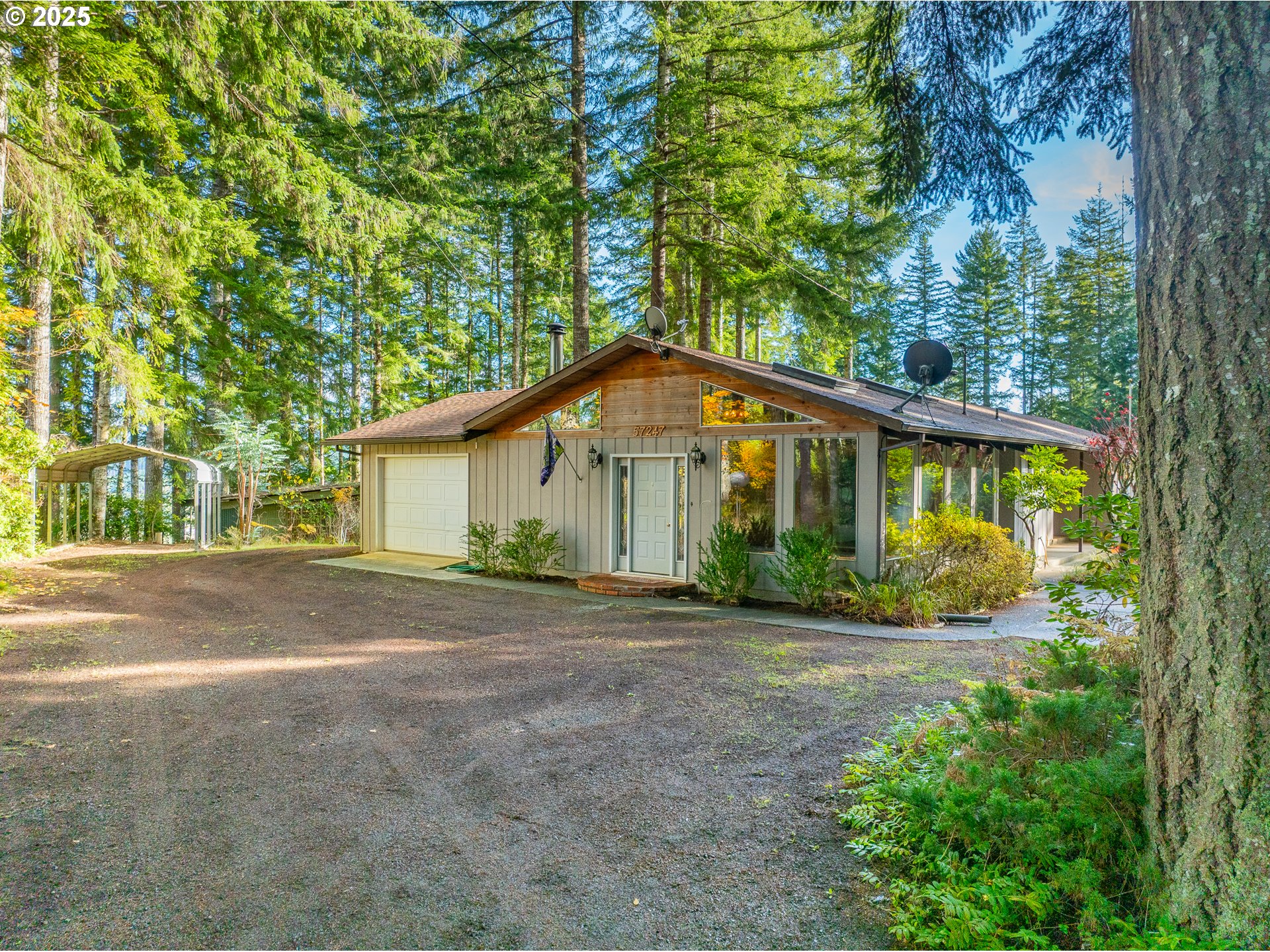 57247 Fairview Road Coquille, OR 97423 - Photo 10 of 45 a front view of a house with a garden