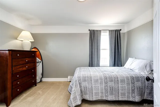 a view of a terrace with a table and chairs