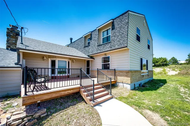 a view of balcony with wooden floor
