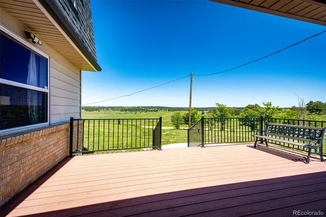a kitchen with stainless steel appliances granite countertop a stove and a wooden floors