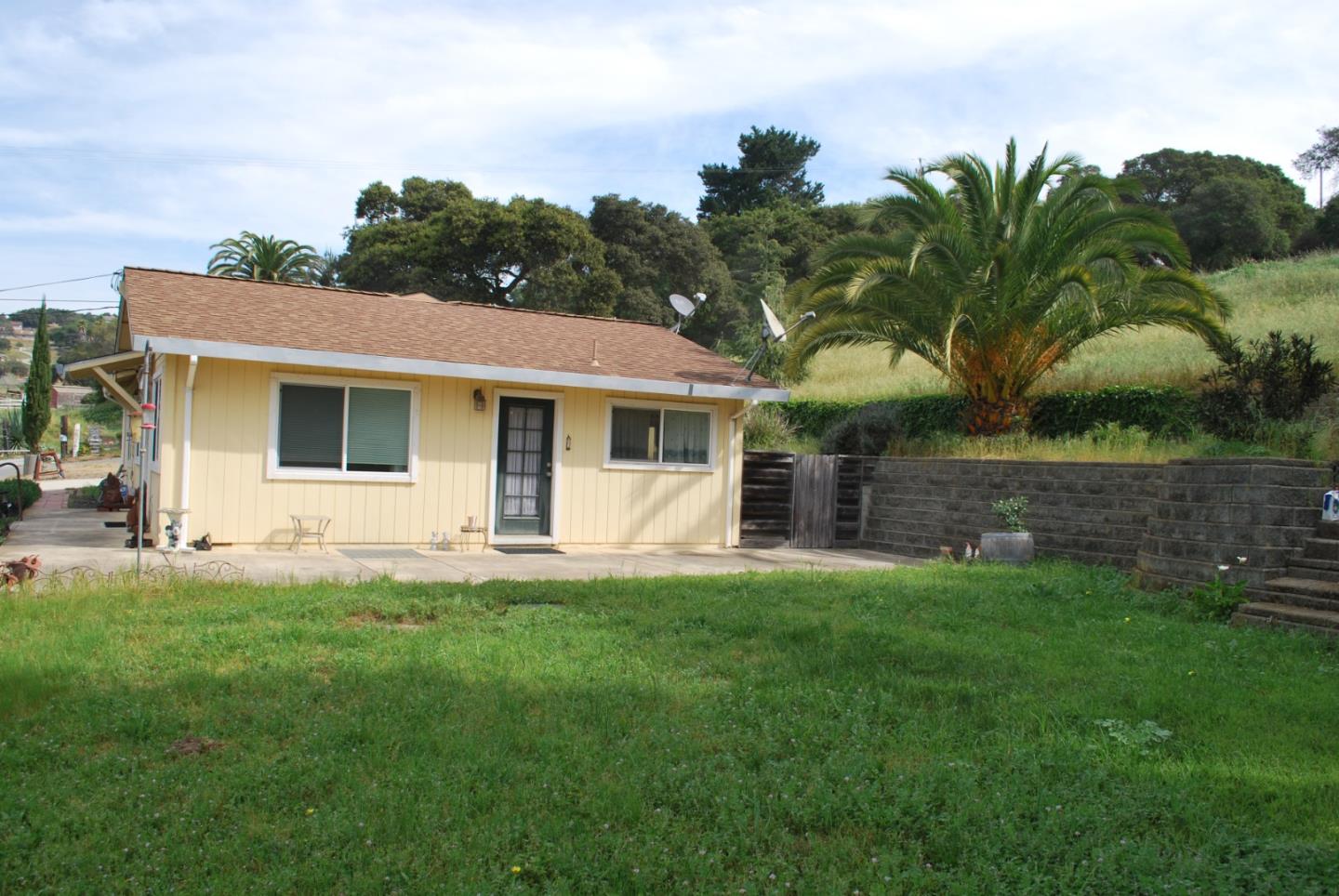 9194 Coker Road Salinas, CA 93907 - Photo 19 of 27 a front view of a house with a garden