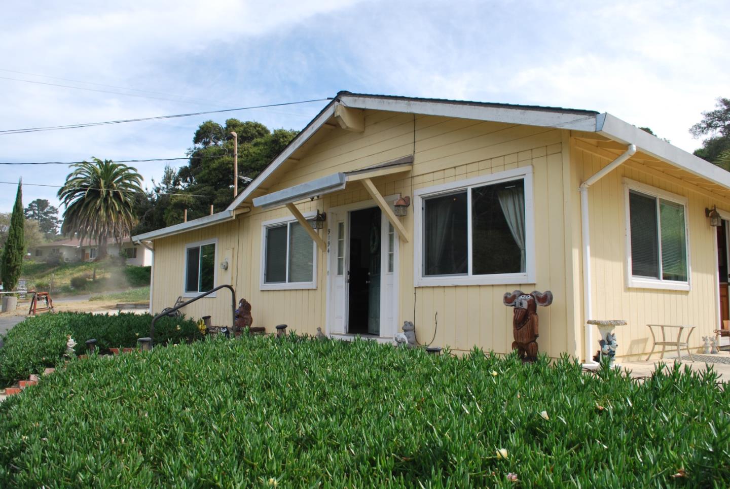 9194 Coker Road Salinas, CA 93907 - Photo 2 of 27 a view of a house with many windows and plants