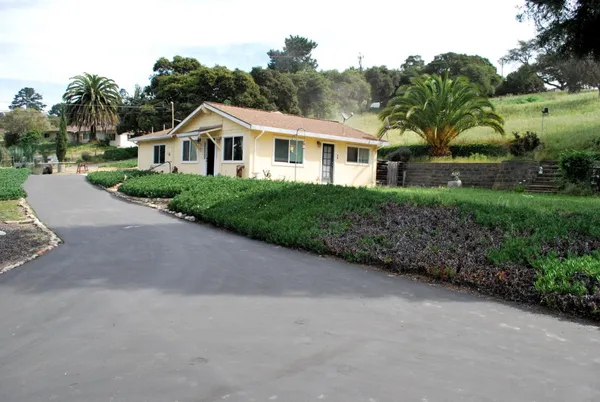 a view of a back yard of the house