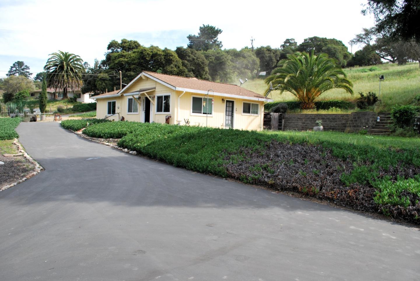9194 Coker Road Salinas, CA 93907 - Photo 25 of 27 a front view of a house with a yard and garage