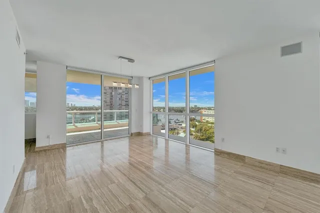 a kitchen with granite countertop wooden cabinets and sink