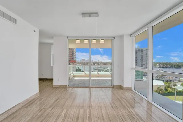 a kitchen with granite countertop wooden cabinets and stainless steel appliances