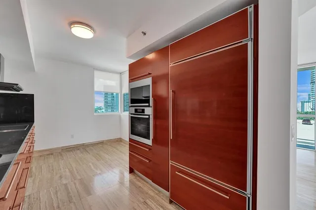 a bathroom with a shower and a glass door