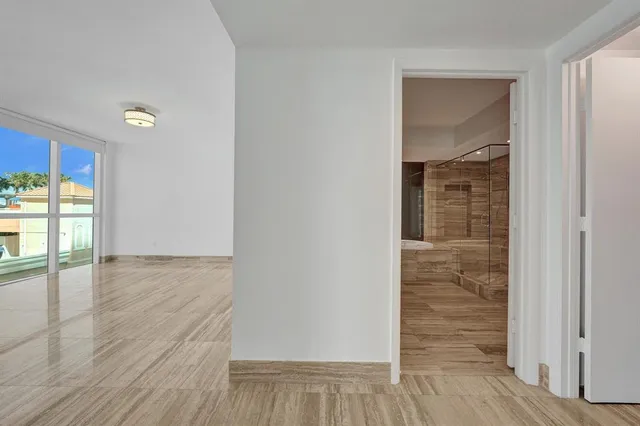 a view of swimming pool with a lounge chair and dinning table under an umbrella