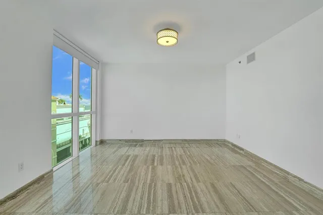 a view of living room kitchen with furniture and wooden floor